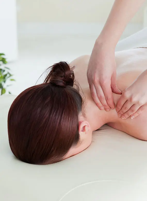 Acupressure therapy on the neck and upper back for pain and tension relief in East Setauket NY